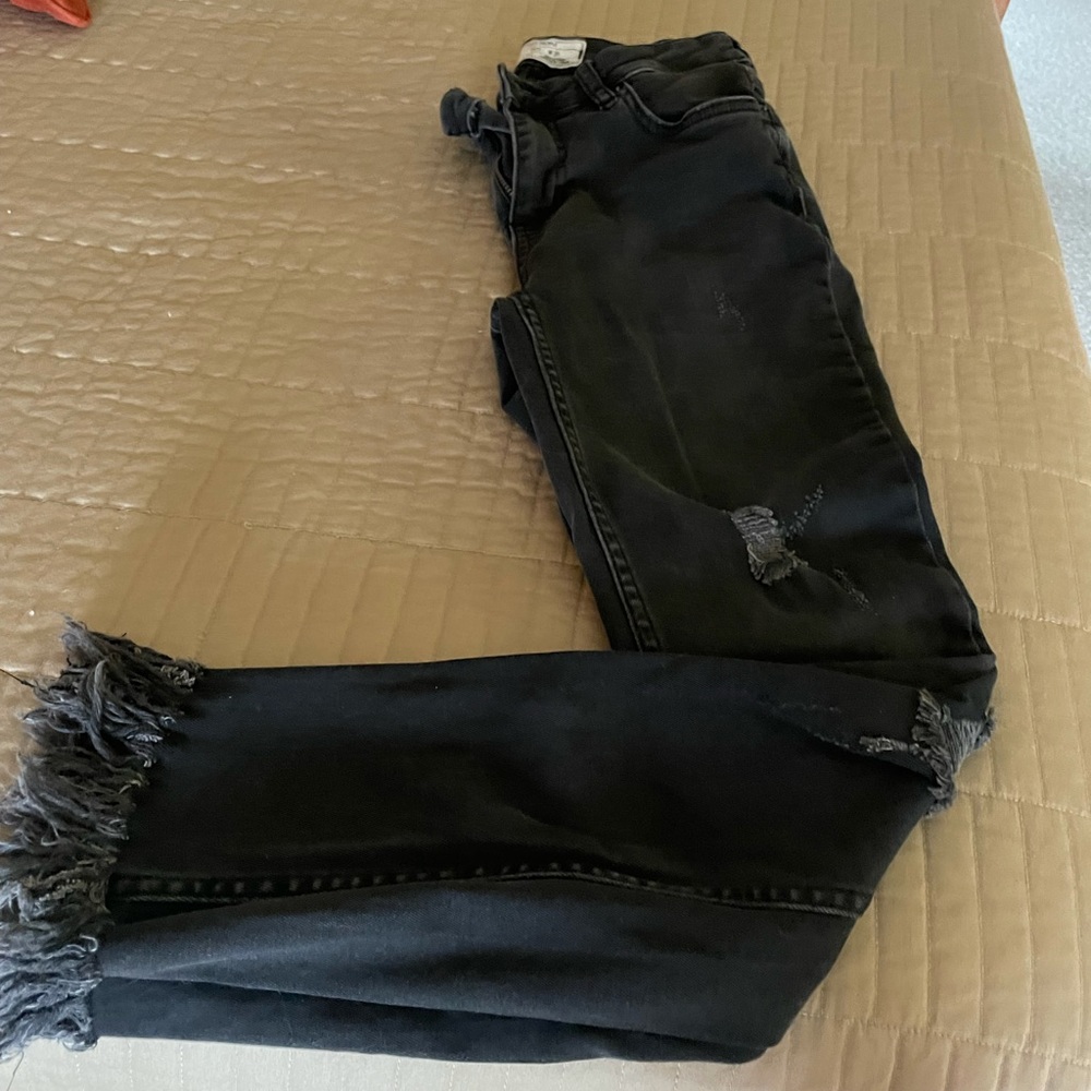 Free People black distressed fringe bottom jeans